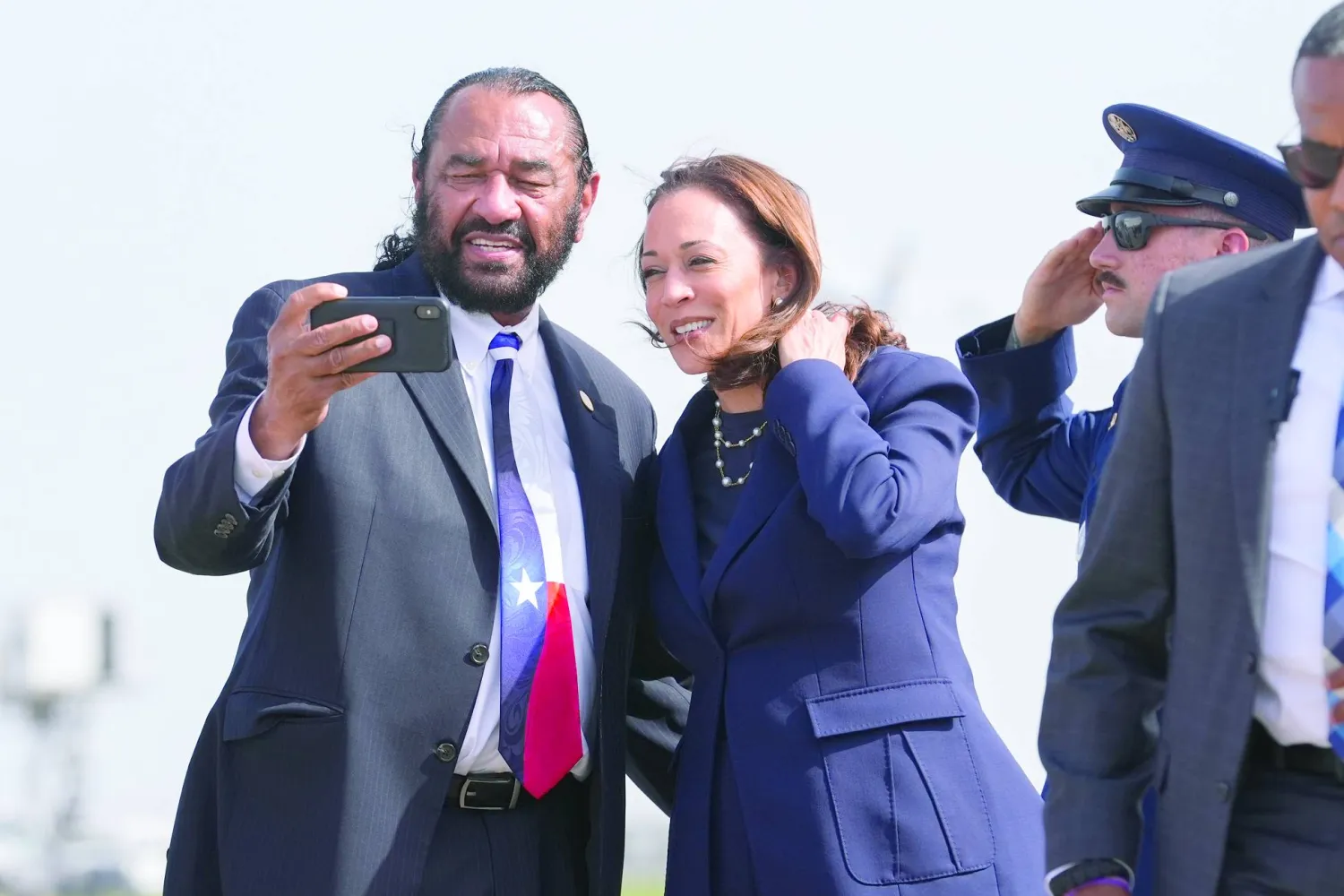 Vice President Kamala Harris, right, takes a photo with Rep. Al Green, D-Texas, left, during her arrival in Houston, Wednesday, July 31, 2024. (AP Photo/LM Otero)