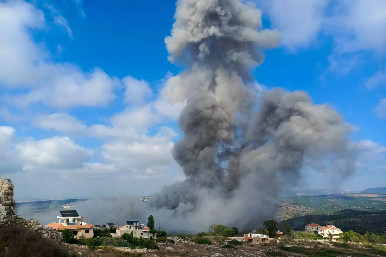 Smoke ascends after an Israeli air raid on the town of Chamaa in southern Lebanon on August 1, 2024. (Photo by KAWNAT HAJU / AFP)