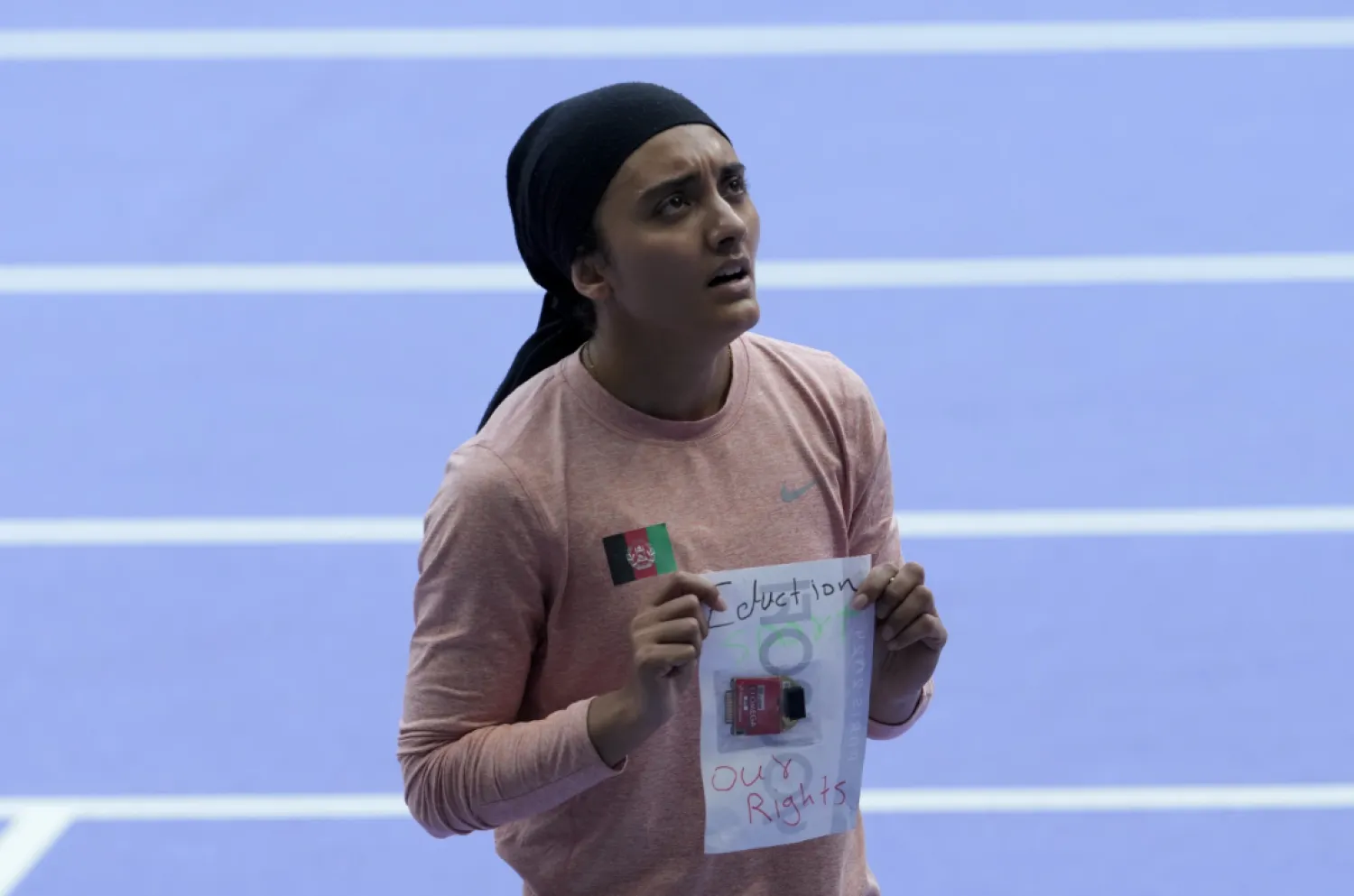Kimia Yousofi after finishing last in her 100-meter preliminary heat - The AP
