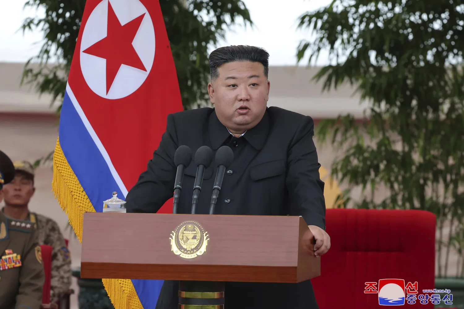 In this photo provided by the North Korean government, North Korean leader Kim Jong Un speaks as he visits an air force helicopter unit to praise the troops for helping rescue people from recent floods, at an undisclosed location in North Korea, Friday, Aug. 2, 2024. (Korean Central News Agency/Korea News Service via AP)