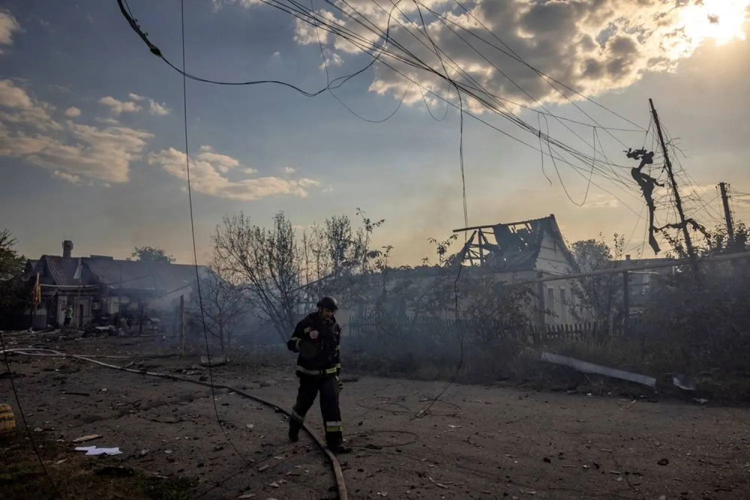  An emergency worker walks past a house that was destroyed after a Russian strike on a residential area in Pokrovsk amid Russia's attack on Ukraine, August 3, 2024. (Reuters)