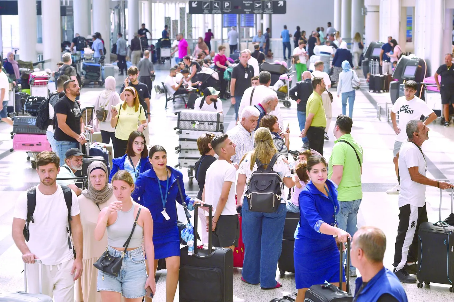 Passengers wait after their flights were delayed or canceled at Rafic Hariri International Airport, in Beirut, Lebanon, 05 August 2024. EPA/WAEL HAMZEH