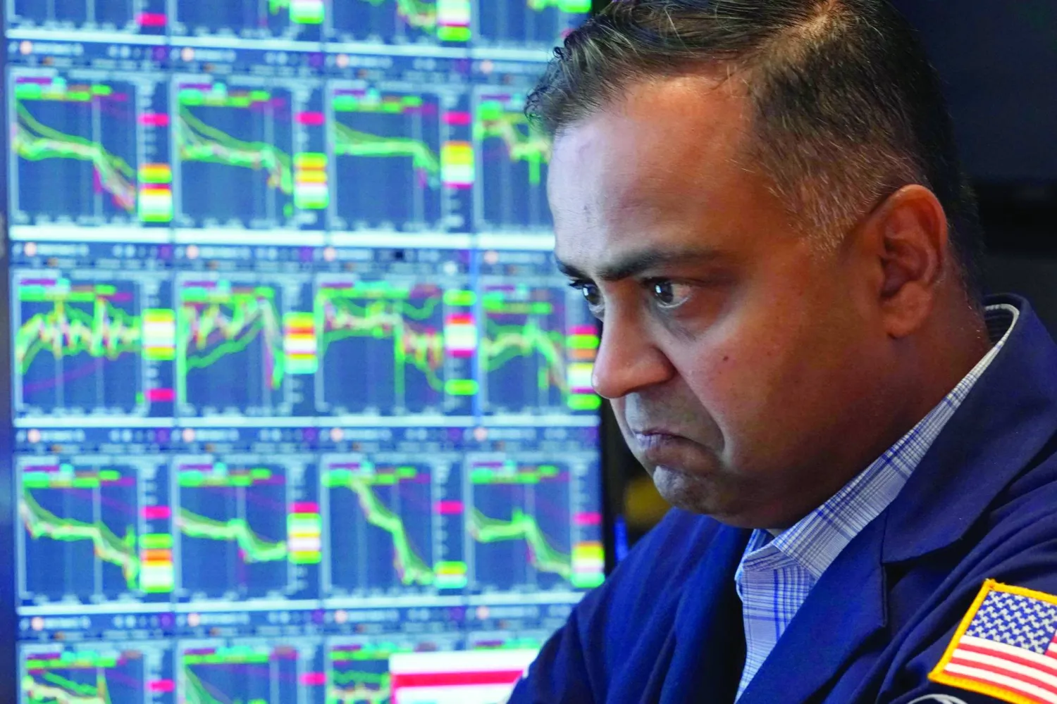 Specialist Dilip Patel works at his post on the floor of the New York Stock Exchange, Monday, Aug. 5, 2024. Nearly everything on Wall Street is tumbling as fear about a slowing US economy worsens and sets off another sell-off for financial markets around the world.(AP Photo/Richard Drew)