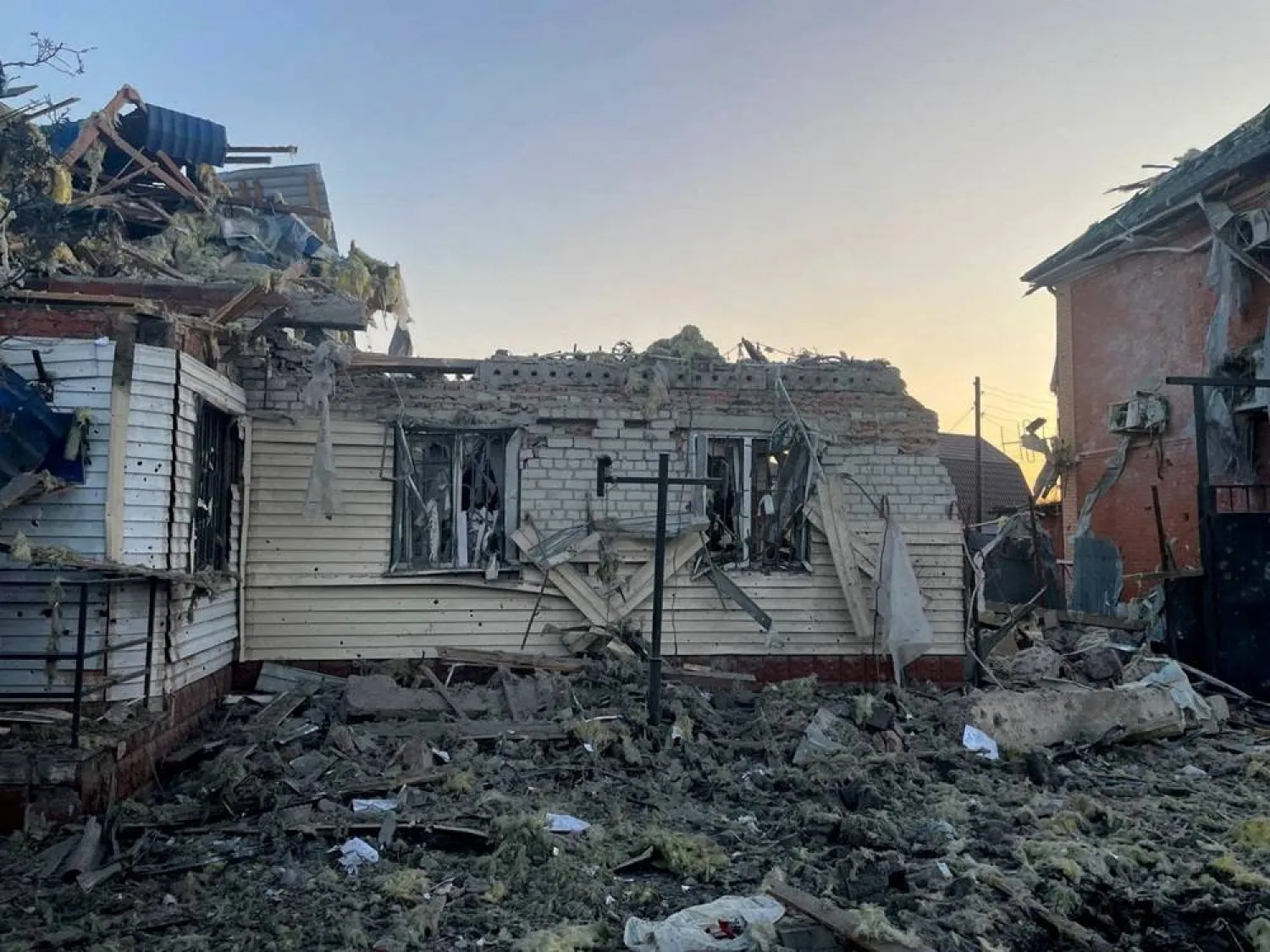 A view shows a damaged house following what local authorities called a Ukrainian military strike, in the course of the Russia-Ukraine conflict in the town of Sudzha in the Kursk Region, Russia, in this handout image released August 6, 2024. (Acting Governor of Kursk Region Alexei Smirnov via Telegram/Handout via Reuters) 
