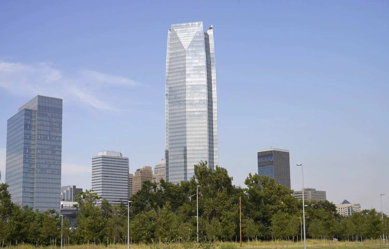FILE - The Devon Energy Tower dwarfs other downtown buildings, Sept. 27, 2021, in Oklahoma City. (AP Photo/Sue Ogrocki, file)