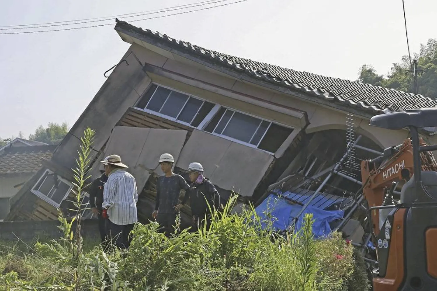  A house is seen collapsed in Oosaki town, Kagoshima prefecture, southern Japan Friday, Aug. 9, 2024, following Thursday's powerful earthquake. (Kyodo News via AP) 