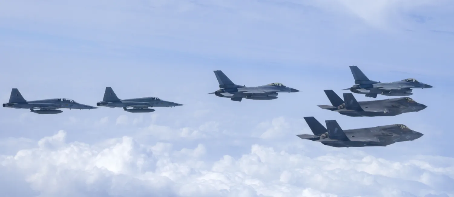 In this photo provided by the South Korean Defense Ministry, US Marine F- 35B fighter jets, right bottom, South Korean Air Force KF-16 fighter jets and F-5 fighter jets, left, fly over the Korean Peninsula during a joint air drill over South Korea, Wednesday, July 24, 2024. (South Korea Defense Ministry via AP)
