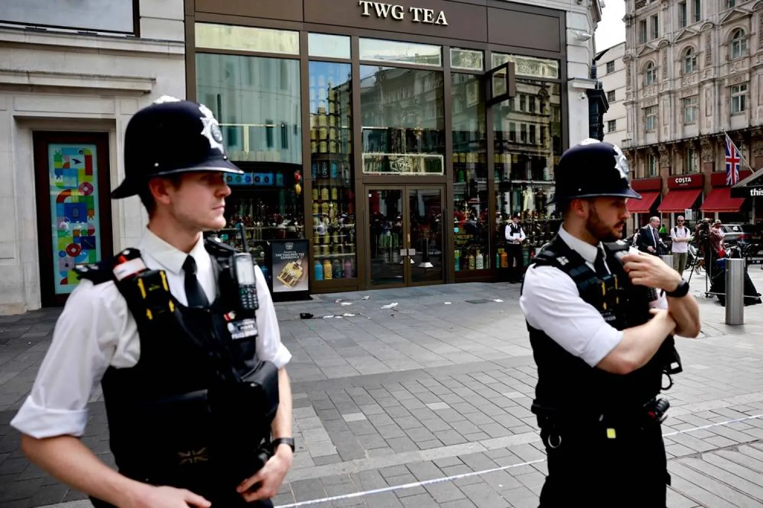 A photograph taken on August 12, 2024 shows police officers standing by a cordoned off area in Leicester square, London. (AFP)