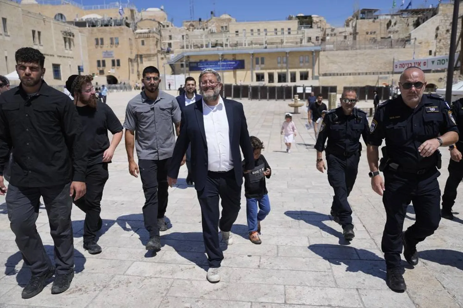 Israel's far-right National Security Minister Itamar Ben-Gvir, center, flanked by his security detail, approach the entrance to Jerusalem's most sensitive holy site, which Jews revere the site as the Temple Mount, believed to be the location of the First and Second Temples, and it is a holy site for Muslims as Haram al-Sharif or the Noble Sanctuary, in the Old City, Tuesday, Aug. 13, 2024. (AP) 