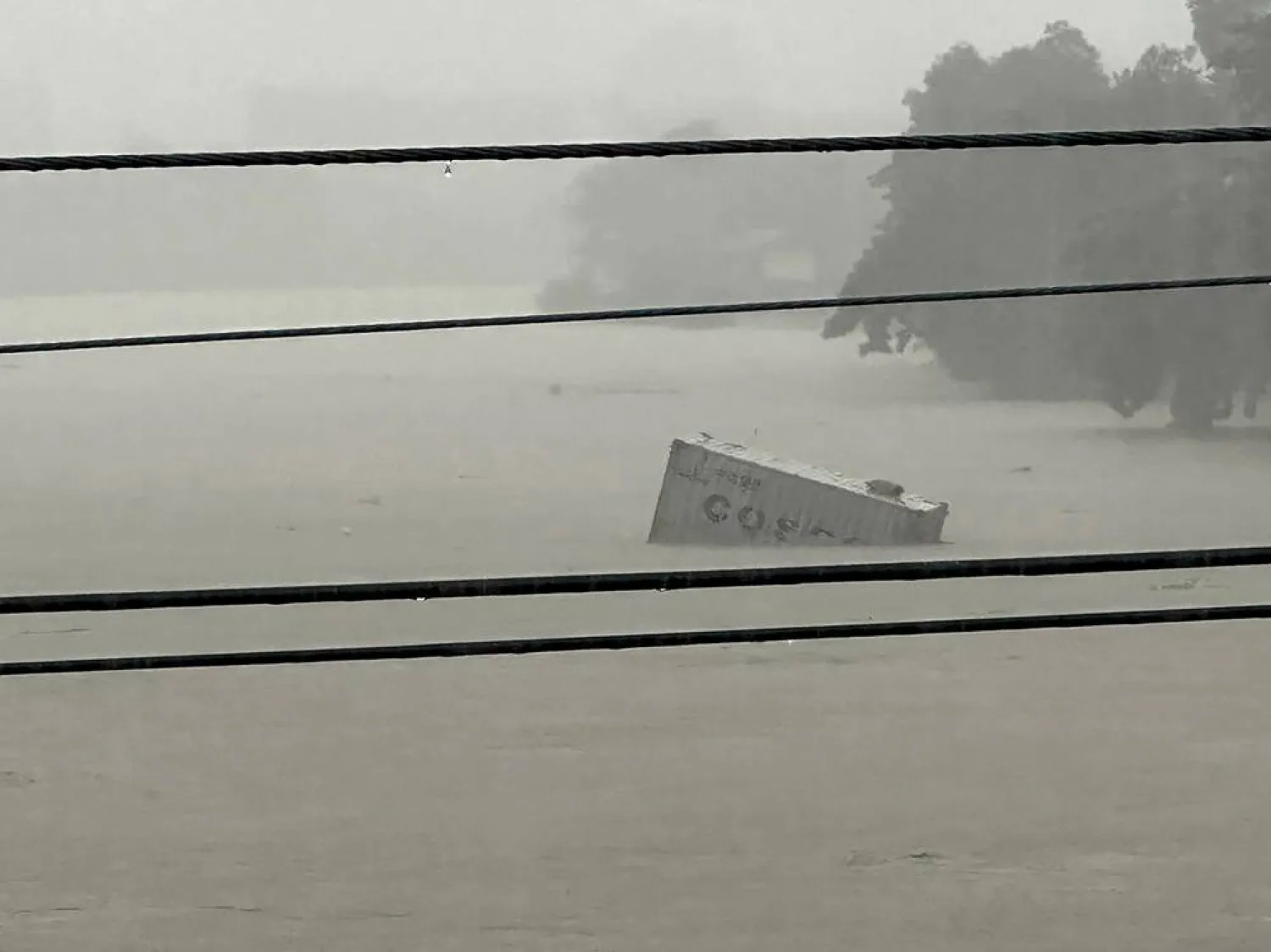 A container floats on swollen Marikina River as monsoon rains worsened by offshore typhoon Gaemi on July 24, 2024, in Manila, Philippines. (AP)
