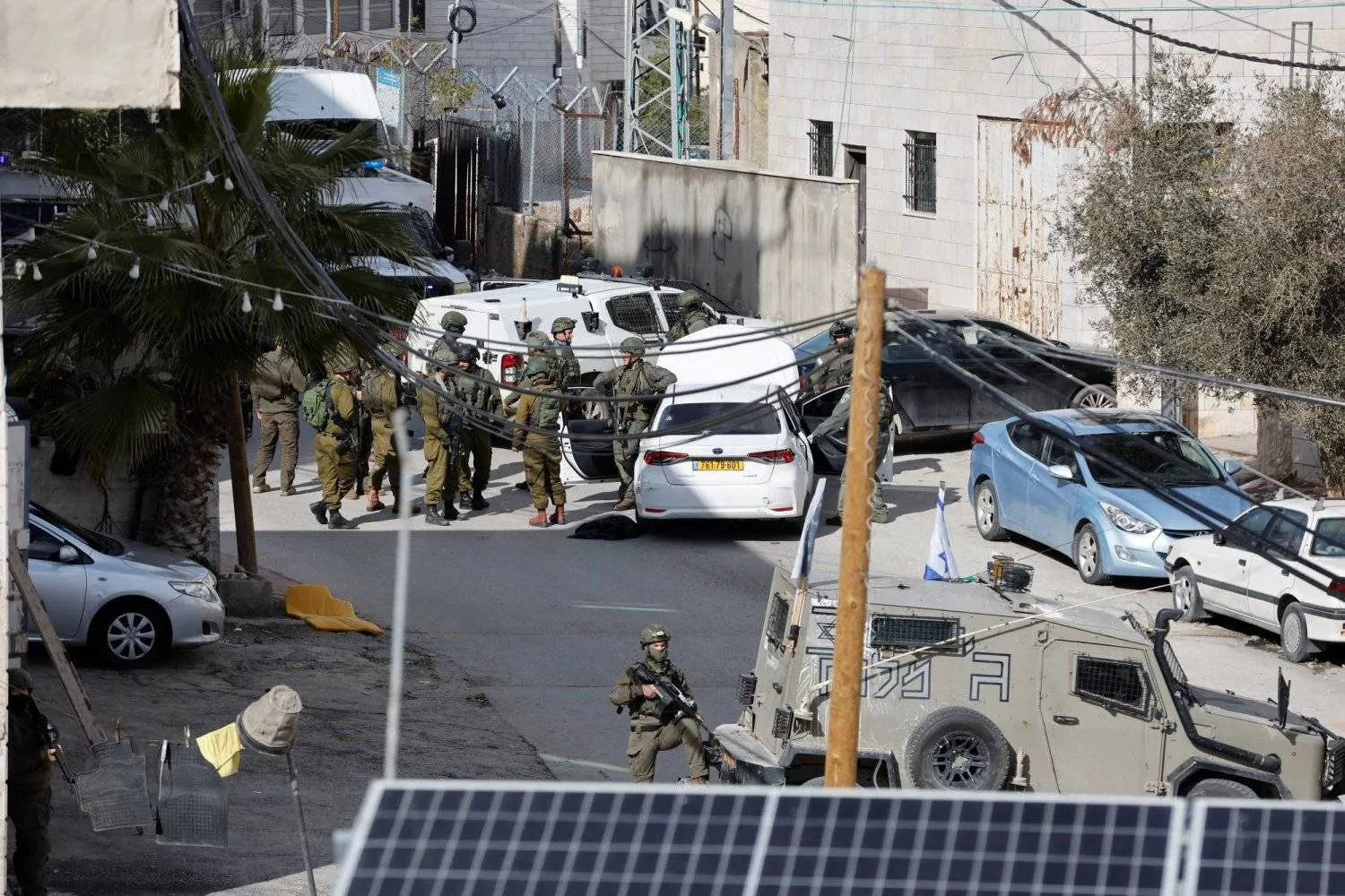 Israeli troops stand guard near a shooting scene in Hebron in the Israeli-occupied West Bank February 1, 2024. REUTERS/Mussa Qawasma/File Photo