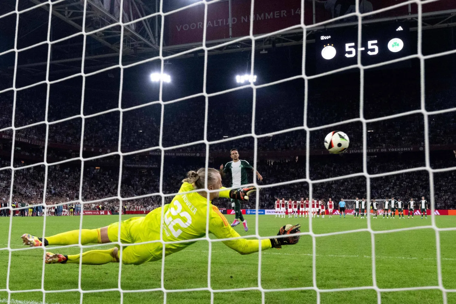 Ajax's Dutch goalkeeper #22 Remko Pasveer (C) saves a penalty during the penalty shootout at the end of the UEFA Europa League 3rd Qualifying Round second leg football match between Ajax FC and Panathinaikos FC at the Johan Cruyff Arena, in Amsterdam, on August 15, 2024. (Photo by Olaf Kraak / ANP / AFP) 

