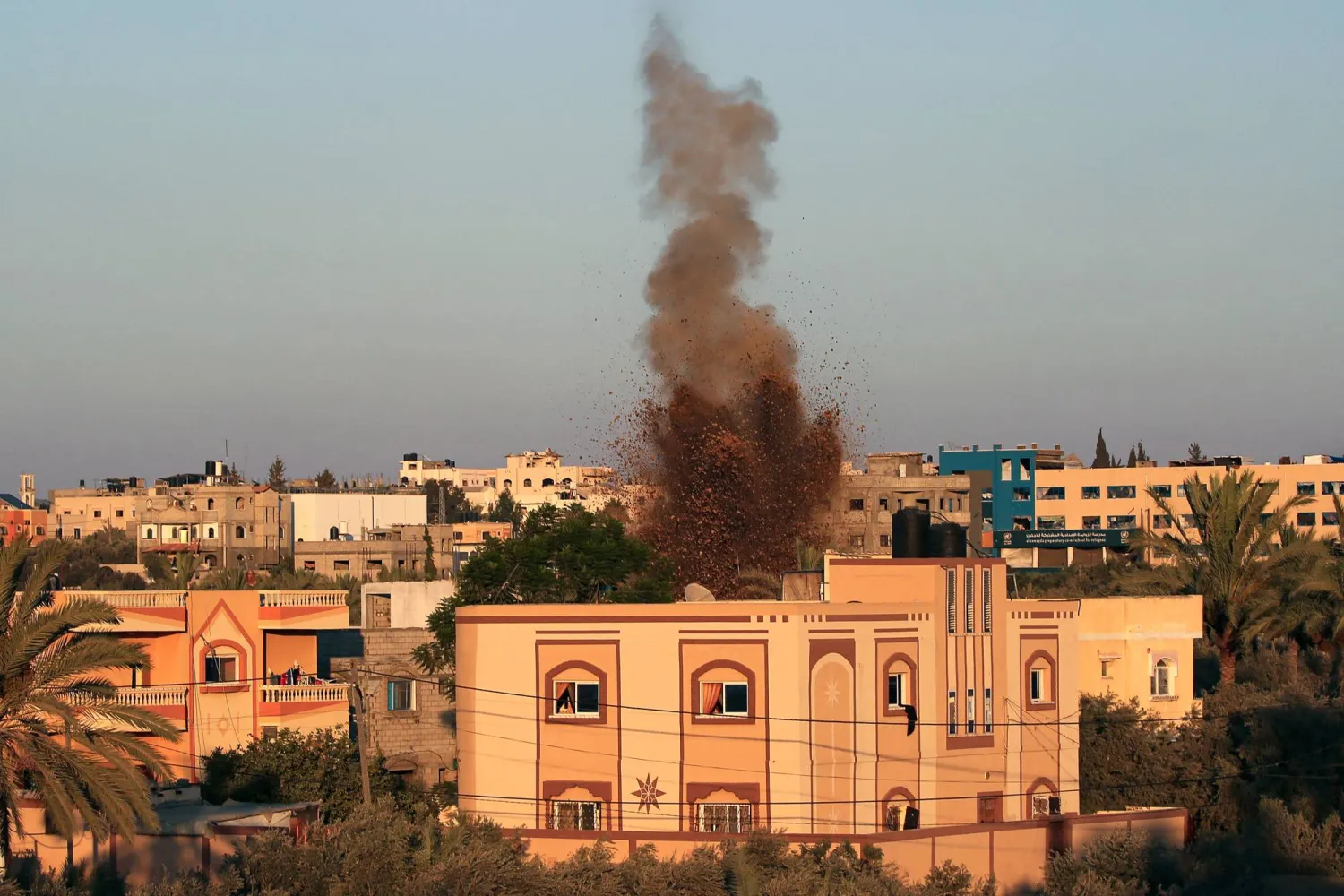 Smoke and soil billow after an Israeli strike in al-Zawayda in the central Gaza Strip on August 8, 2024. (Photo by Eyad BABA / AFP)