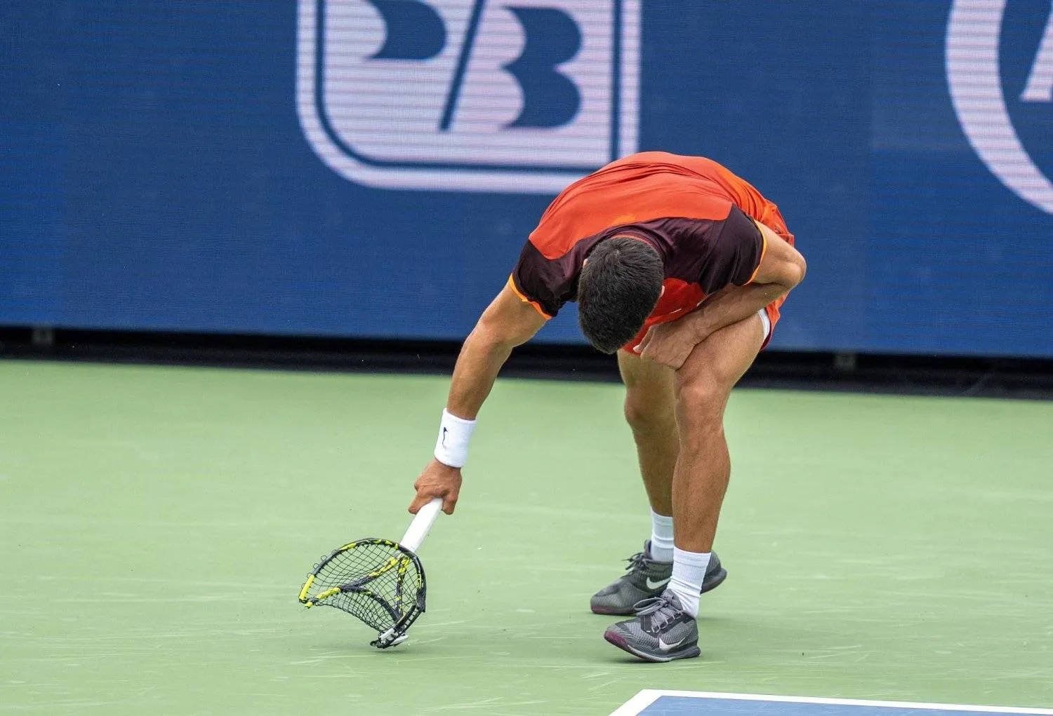 Aug 16, 2024; Cincinnati, OH, USA; Carlos Alcaraz of Spain smashes his racket during his match against Gael Monfils of France on day five of the Cincinnati Open. Mandatory Credit: Susan Mullane-USA TODAY Sports