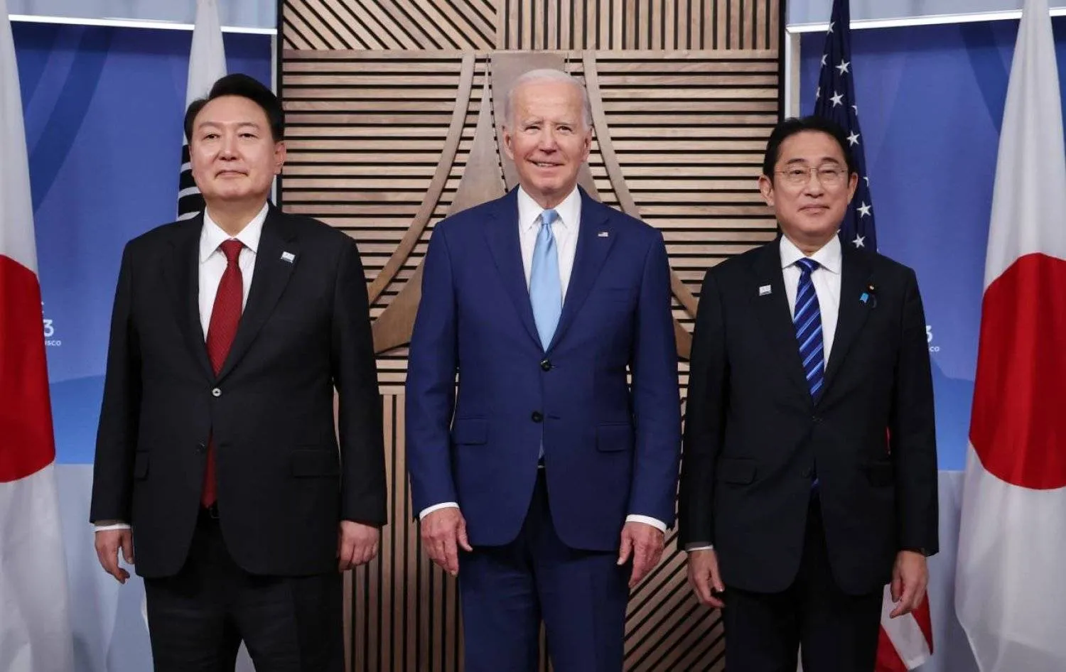 US President Joe Biden, South Korea's President Yoon Suk Yeol and Japanese Prime Minister Fumio Kishida stand together for a trilateral meeting at the Asia-Pacific Economic Cooperation (APEC) summit in San Francisco, California, US, November 16, 2023. REUTERS/Kevin Lamarque
