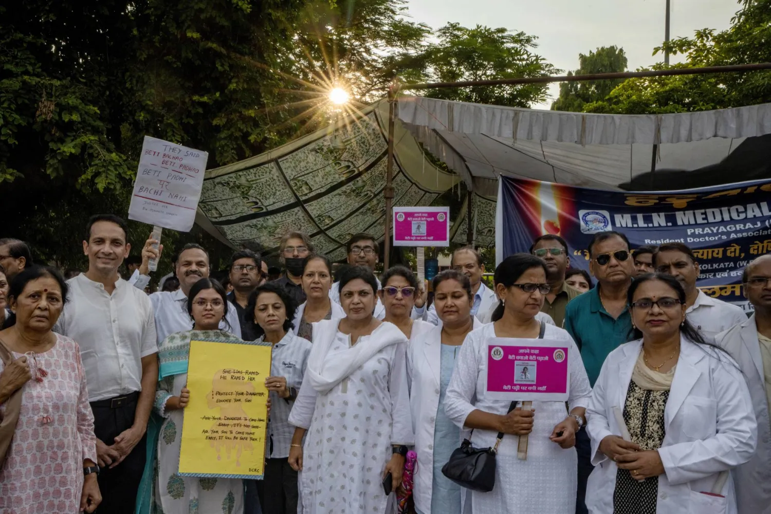 Allahabad Medical Association (AMA) and Resident doctors of SRN Hospital protesting against the rape and murder of a medic in Kolkata last week, hold placards in Prayagraj, Uttar Pradesh, India, Saturday, Aug. 17, 2024. (AP Photo/Rajesh Kumar Singh)