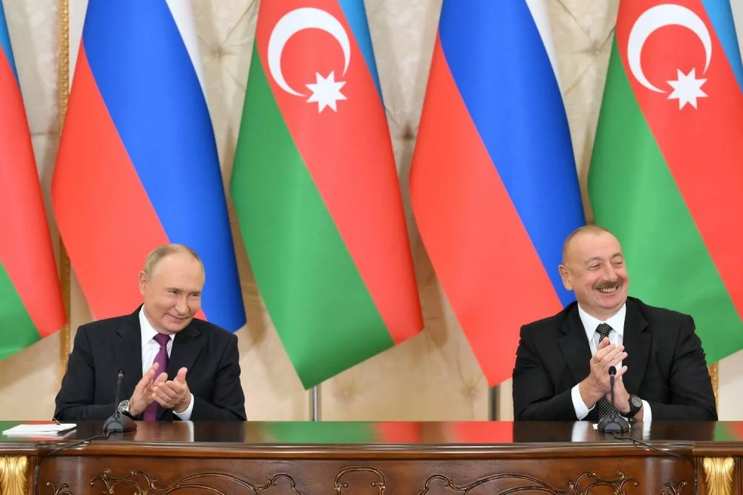 Russian President Vladimir Putin (L) and Azerbaijani President Ilham Aliyev attend a signing ceremony following a meeting at the Zagulba Residence outside Baku, Azerbaijan, 19 August 2024. (EPA/Grigory Sysoev / Sputnik / Kremlin Pool)