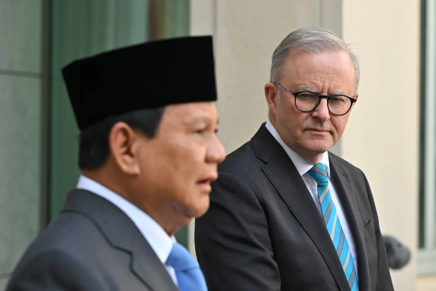 Indonesia's Defense Minister and President-elect Prabowo Subianto (L) and Australian Prime Minister Anthony Albanese (R) take part in a joint statement at Parliament House in Canberra, Australia, 20 August 2024. EPA/MICK TSIKAS  