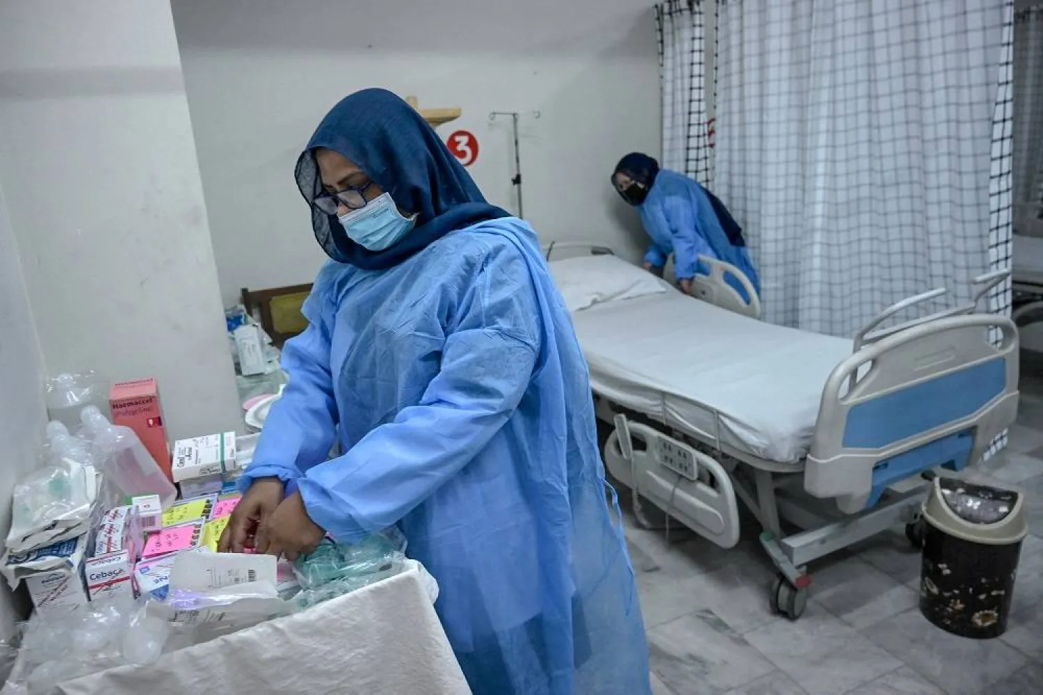 Health workers prepare an isolation ward for mpox patients at the Police and Services hospital in Peshawar on August 20, 2024. (AFP)
