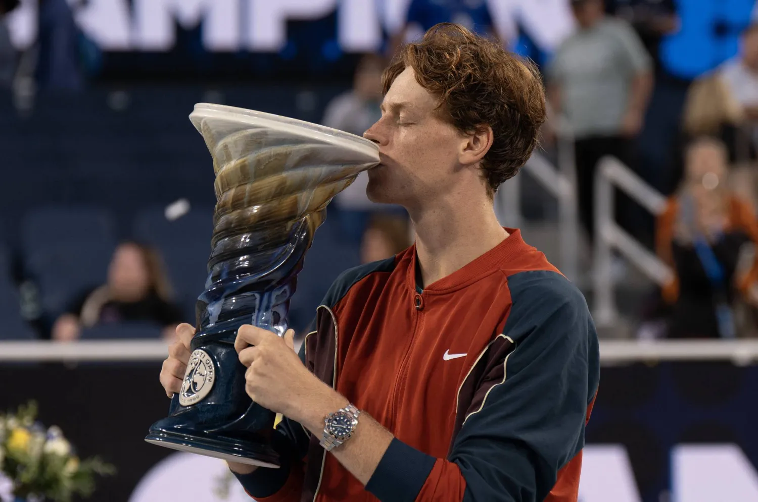 Aug 19 2024; Cincinnati, OH, USA; Jannik Sinner of Italy kisses the Rookwood Cup trophy after winning the men’s singles final against Frances Tiafoe of the United States on day seven of the Cincinnati Open. Mandatory Credit: Susan Mullane-USA TODAY Sports