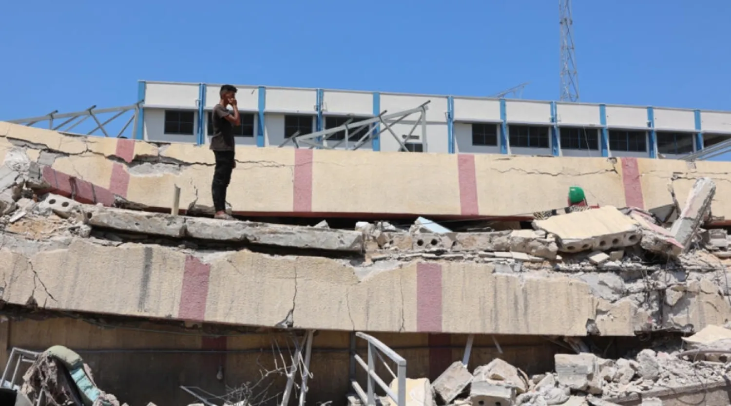 A man inspects the damage after an Israeli strike on a school housing displaced Palestinians in the Rimal neighbourhood of central Gaza City on August 20, 2024. © Omar al-Qattaa, AFP