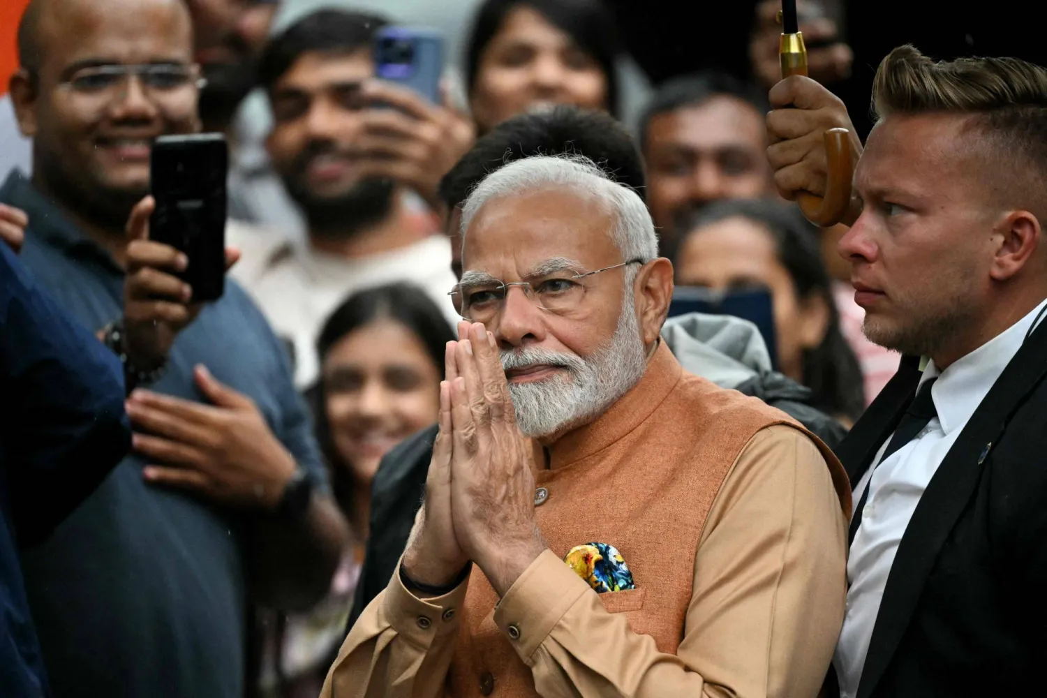 Indian Prime Minister Narendra Modi gestures as he arrives to pay his respects at the Jam Saheb of Nawanagar Memorial at the Good Maharaja Square, Poland on August 21, 2024. (Photo by Sergei GAPON / AFP)
