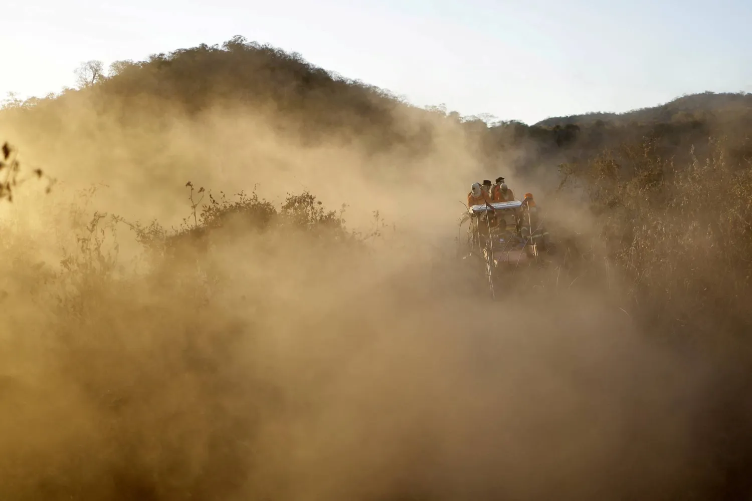 FILE PHOTO: Volunteer firefighter members of the Alto Pantanal Brigade are seen on a tractor as they work to extinguish a fire rising in the Pantanal, the world's largest wetland, in Corumba, Mato Grosso do Sul state, Brazil, June 14, 2024. REUTERS/Ueslei Marcelino/File Photo
