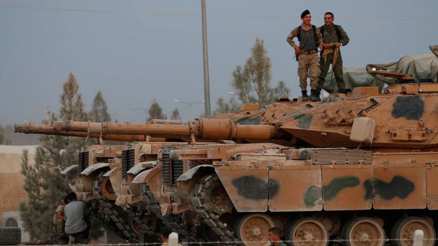 Turkish soldiers stand on top of a tank in the border town of Akcakale in Sanliurfa province, Türkiye, Oct. 11, 2019. (Reuters) 
