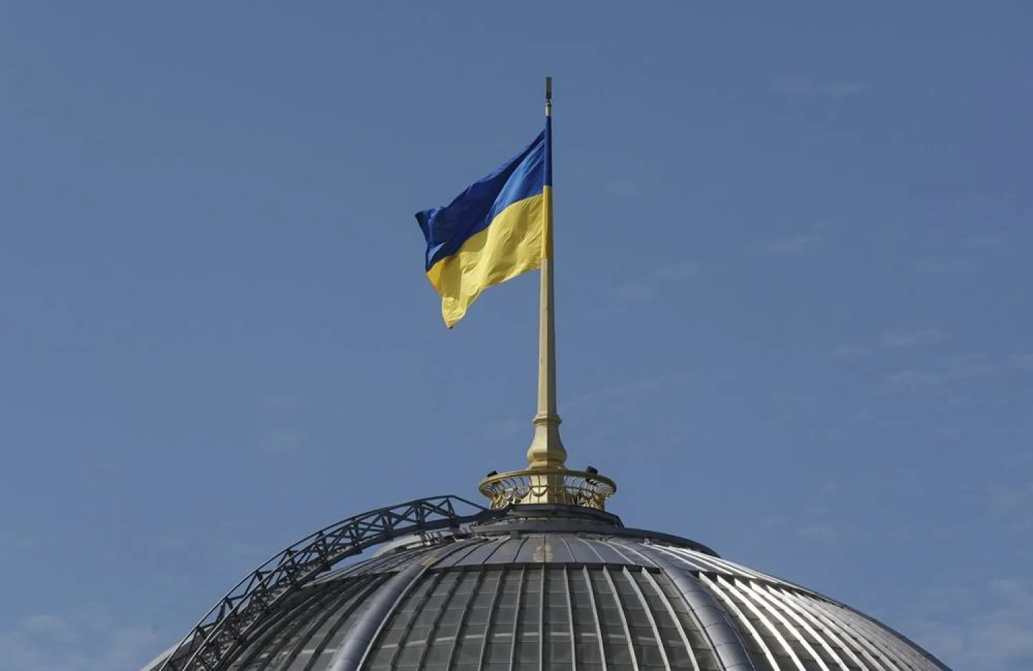 The Ukrainian national flag waves on top of the Verkhovna Rada (Parliament) building during an official visit by India's Prime Minister Modi, in Kyiv, Ukraine, 23 August 2024. (EPA)