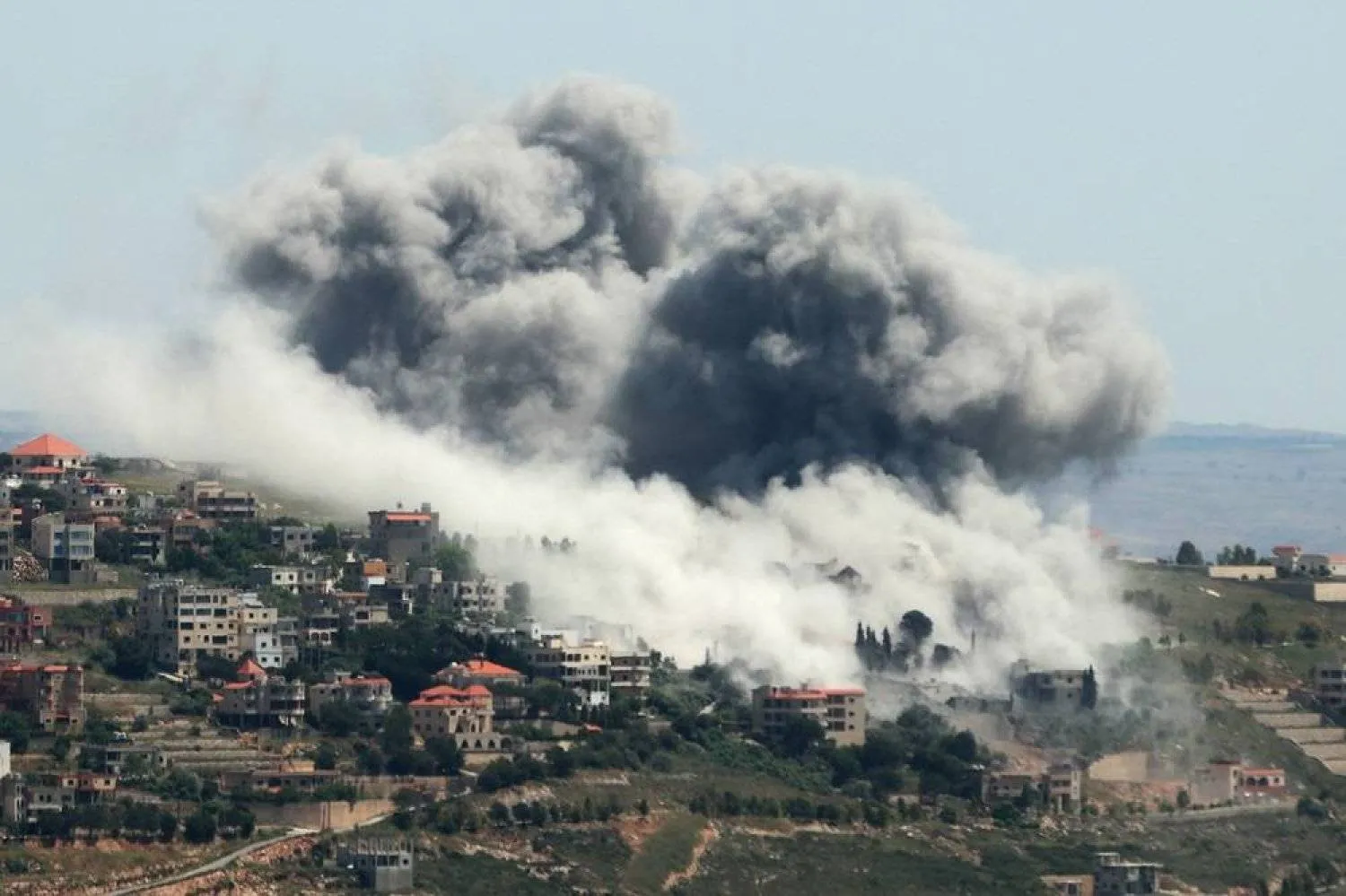 Smoke billows from the site of an Israeli airstrike on the southern Lebanese village of Khiam near the border on May 8, 2024 amid ongoing cross-border tensions as fighting continues between Israel and Palestinian Hamas militants in the Gaza Strip. (AFP)
