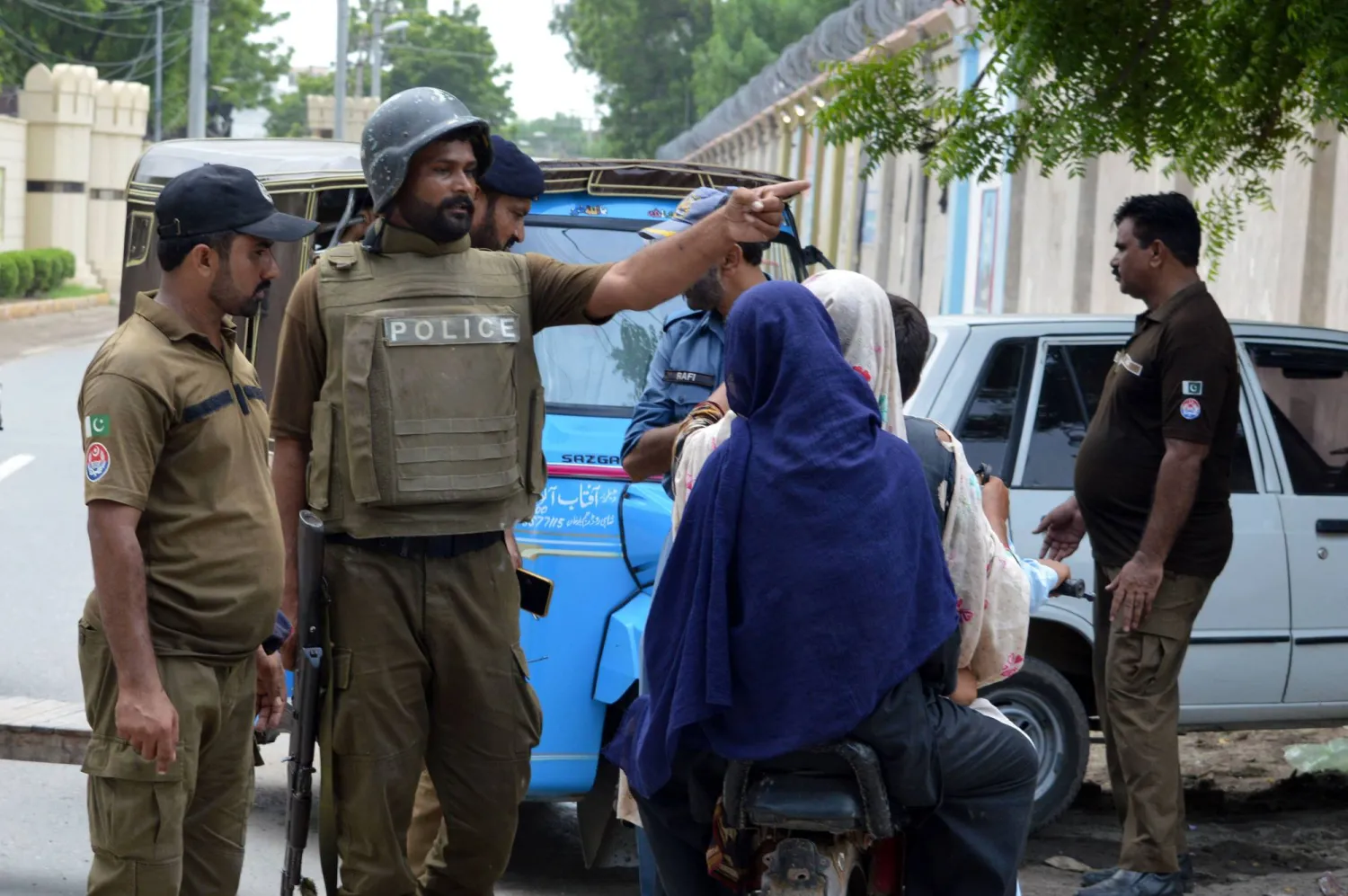 Pakistani security officials stand guard following an attack by criminal gangs, in Rahim Yar Khan district, Punjab province, Pakistan, 23 August 2024. EPA/FAISAL KAREEM