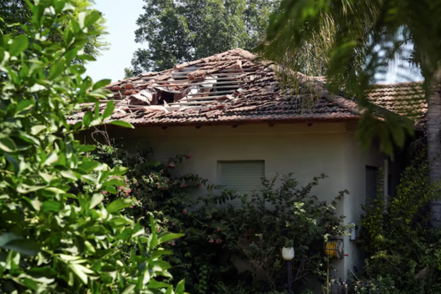 A view shows damage to a residential building, after Hezbollah launched hundreds of rockets and drones towards Israel in what the Iranian-backed movement said was a response to the assassination of a senior commander in Beirut last month, in northern Israel August 25, 2024. REUTERS/Ayal Margolin/File Photo Purchase Licensing Rights