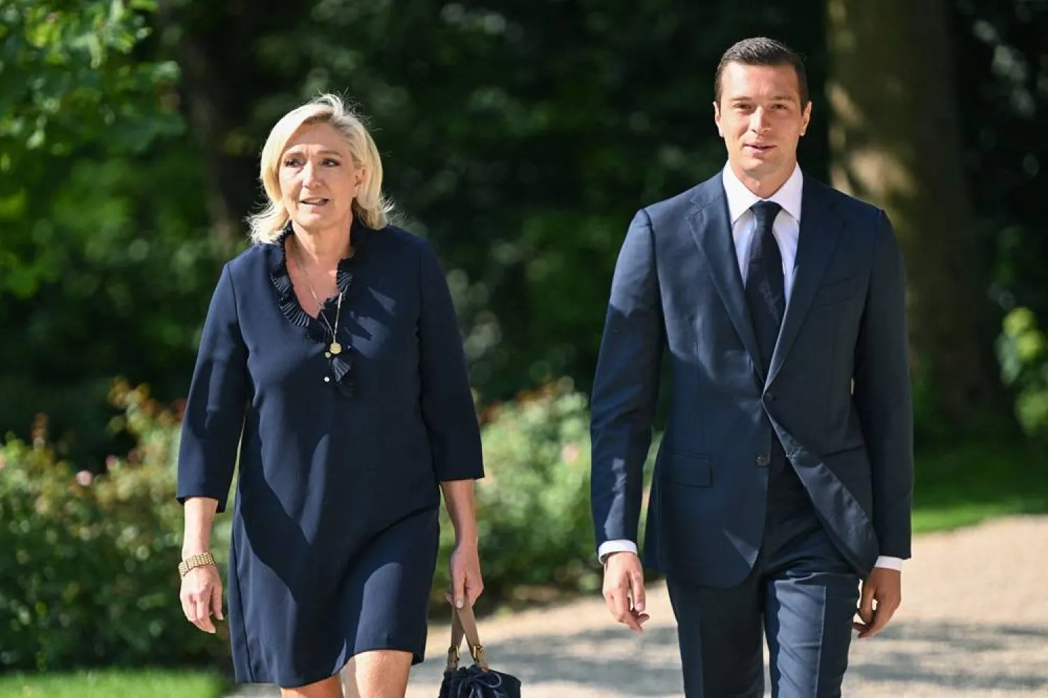 President of the French far-right party Rassemblement National (RN) and MEP Jordan Bardella (R) and French Member of Parliament and French far-right Rassemblement National (National Rally) RN party's leader Marine Le Pen (L) arrive to attend their meeting with French President at the Elysee presidential palace in Paris, on August 26, 2024. (AFP)