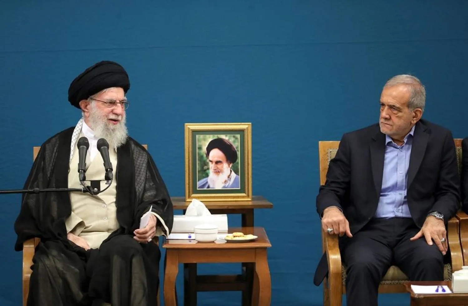 A handout photo made available by the supreme leader office shows Iranian Supreme Leader Ali Khamenei (L) speaking as Iranian President Masoud Pezeshkian looks on, during a meeting with the new Iranian government in Tehran, Iran, 27 August 2024. (EPA/Iranian Supreme Leader Office Handout)