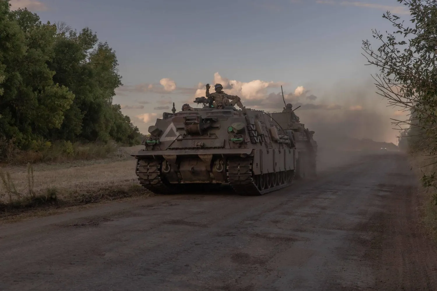 Ukrainian servicemen operate an armored military vehicle in the Sumy region, near the border with Russia, on August 12, 2024, amid the Russian invasion of Ukraine. (Photo by Roman PILIPEY / AFP)