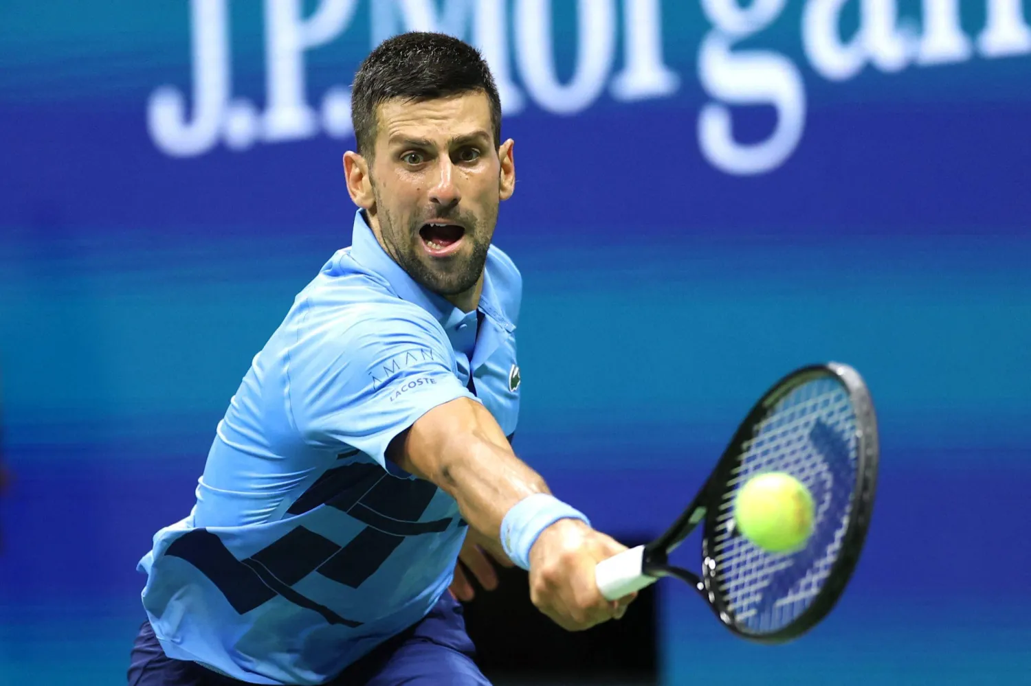 Serbia's Novak Djokovic returns the ball to Serbia's Laslo Djere during their men's singles second round tennis match on day three of the US Open tennis tournament at the USTA Billie Jean King National Tennis Center in New York City, on August 28, 2024. (Photo by CHARLY TRIBALLEAU / AFP)