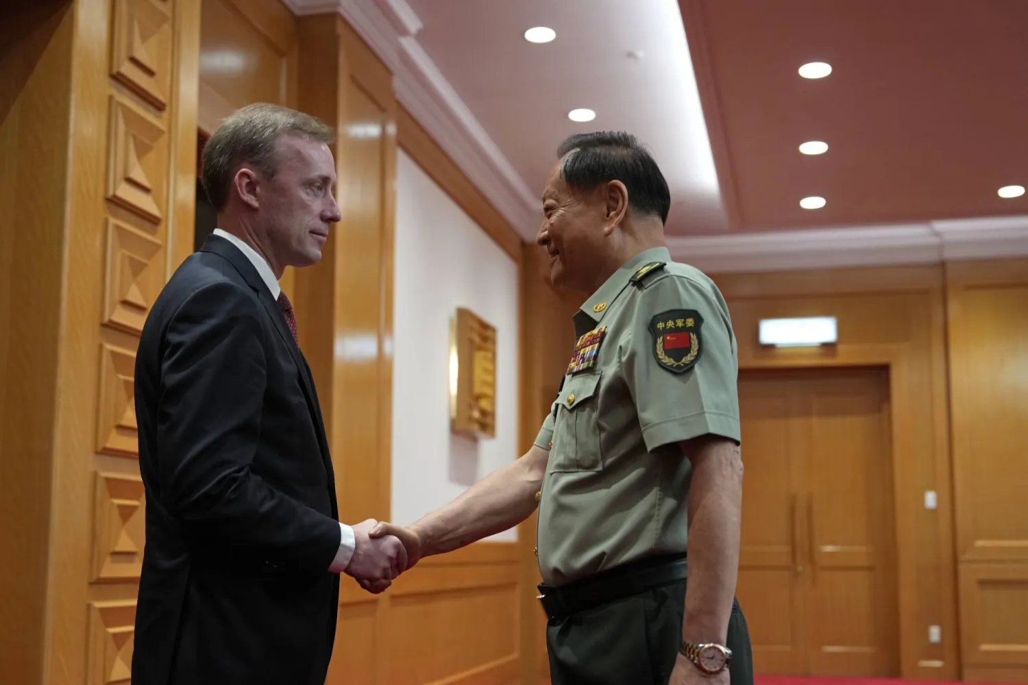 Zhang Youxia, vice chairman of the CPC Central Military Commission, right, shakes hands with White House national security adviser Jake Sullivan before a meeting at the Bayi building in Beijing, Thursday, Aug. 29, 2024. (AP Photo/Ng Han Guan, Pool)