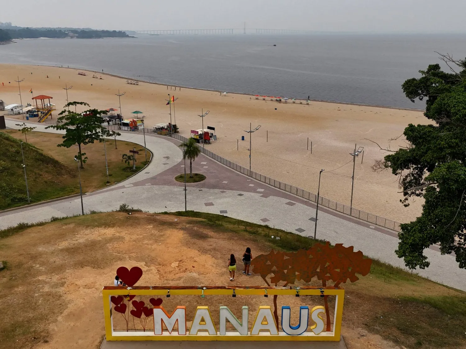 An aerial view of the city of Manuas shrouded in smoke caused by forest fires in Manaus, Amazonas State, Brazil, taken on August 28, 2024. (Photo by MICHAEL DANTAS / AFP)
