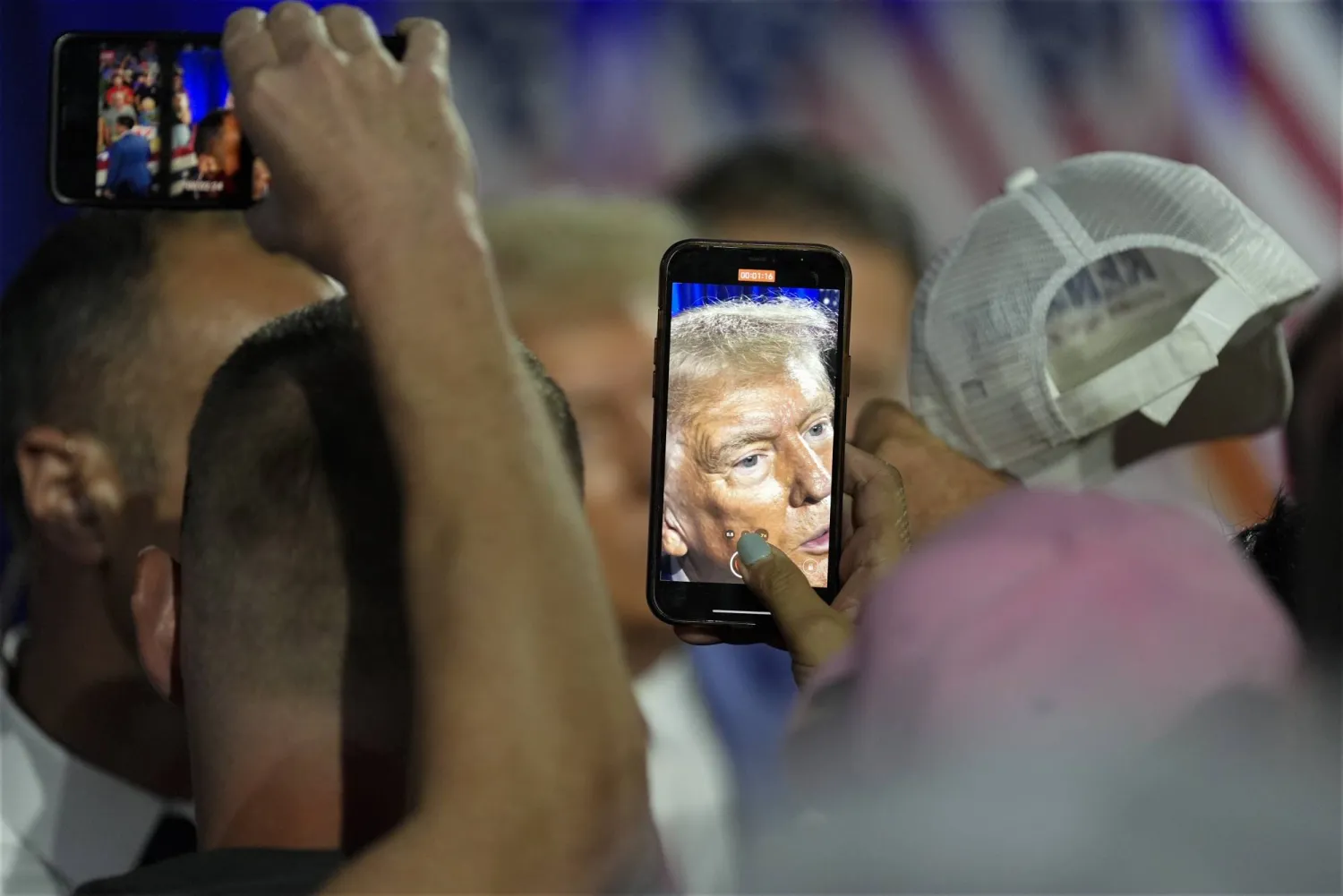 Republican presidential nominee former President Donald Trump greets supporters at a town hall with former Democratic Rep. Tulsi Gabbard, Thursday, Aug. 29, 2024, in La Crosse, Wis. (AP Photo/Morry Gash)