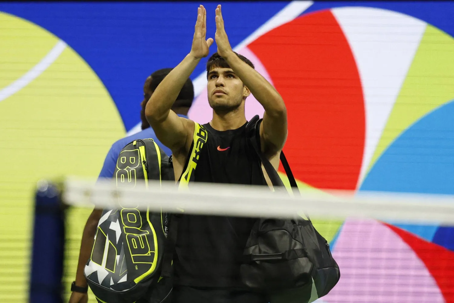 Aug 29, 2024; Flushing, NY, USA; Carlos Alcaraz (ESP) waves to the crowd while leaving the court after his match against Botic van De Zandschlup (NED)(not pictured) in a men's singles match on day four of the 2024 US Open tennis tournament at Billie Jean King National Tennis Center. Mandatory Credit: Geoff Burke-USA TODAY Sports