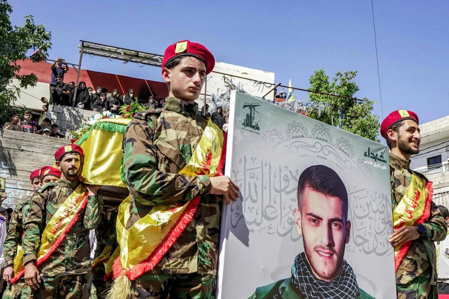 Hezbollah fighters during the funeral of a member killed in an Israeli airstrike in the southern town of Aita al-Shaab on August 23 (AFP)