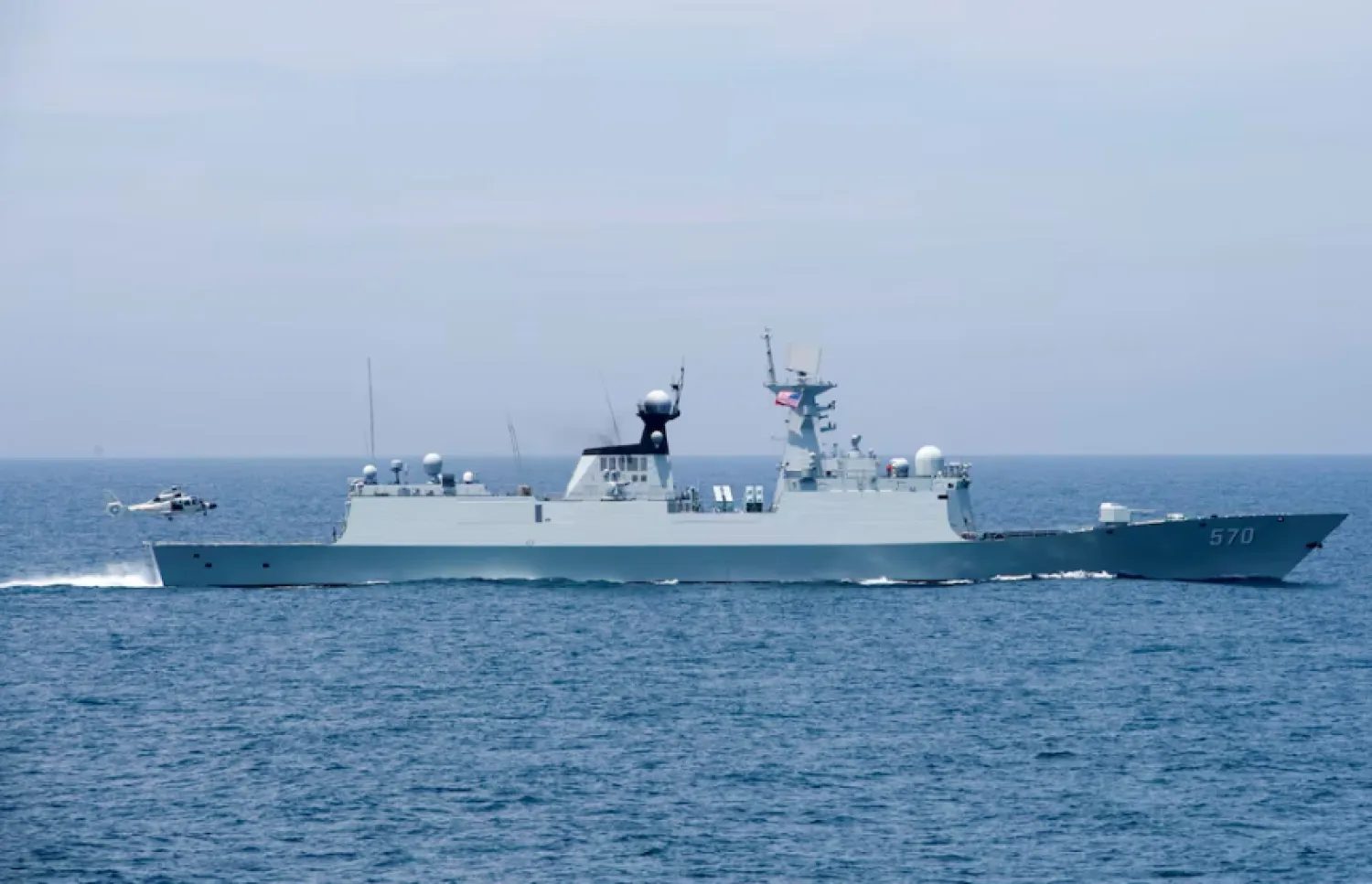 A Chinese naval Z-9 helicopter prepares to land aboard the People's Liberation Army (Navy) frigate CNS Huangshan (FFG-570) as the ship conducts a series of maneuvers and exchanges with the Arleigh Burke-class guided-missile destroyer USS Sterett (DDG 104) in the South China Sea June 16, 2017/Reuters 