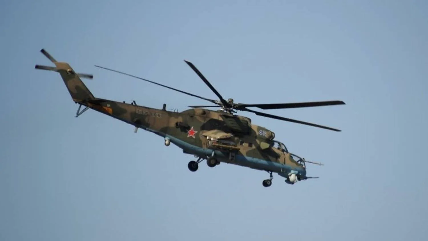 A Russian Mi-24 helicopter flies at the Russian military base of Hmeimim, located south-east of the city of Latakia in Hmeimim, Latakia Governorate, Syria. (File photo: AFP)
