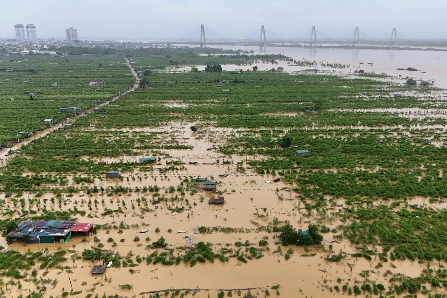 This aerial view shows flooded farms and fields in Hanoi on September 12, 2024. (AFP)