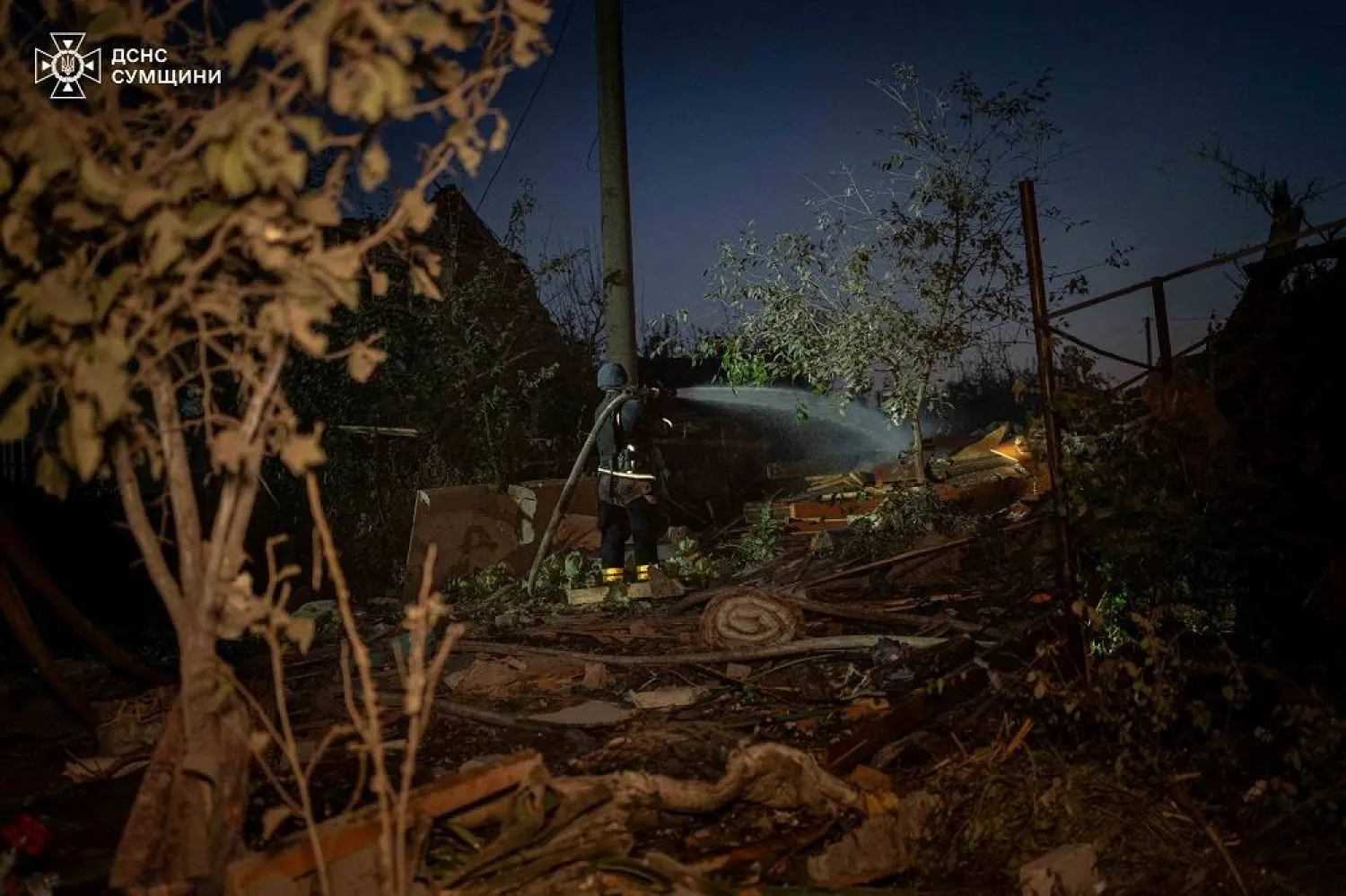 A firefighter works at a site of residential buildings heavily damaged by a Russian air strike, amid Russia's attack on Ukraine, in Sumy, Ukraine September 8, 2024. (Press service of the State Emergency Service of Ukraine in Sumy region/Handout via Reuters) 
