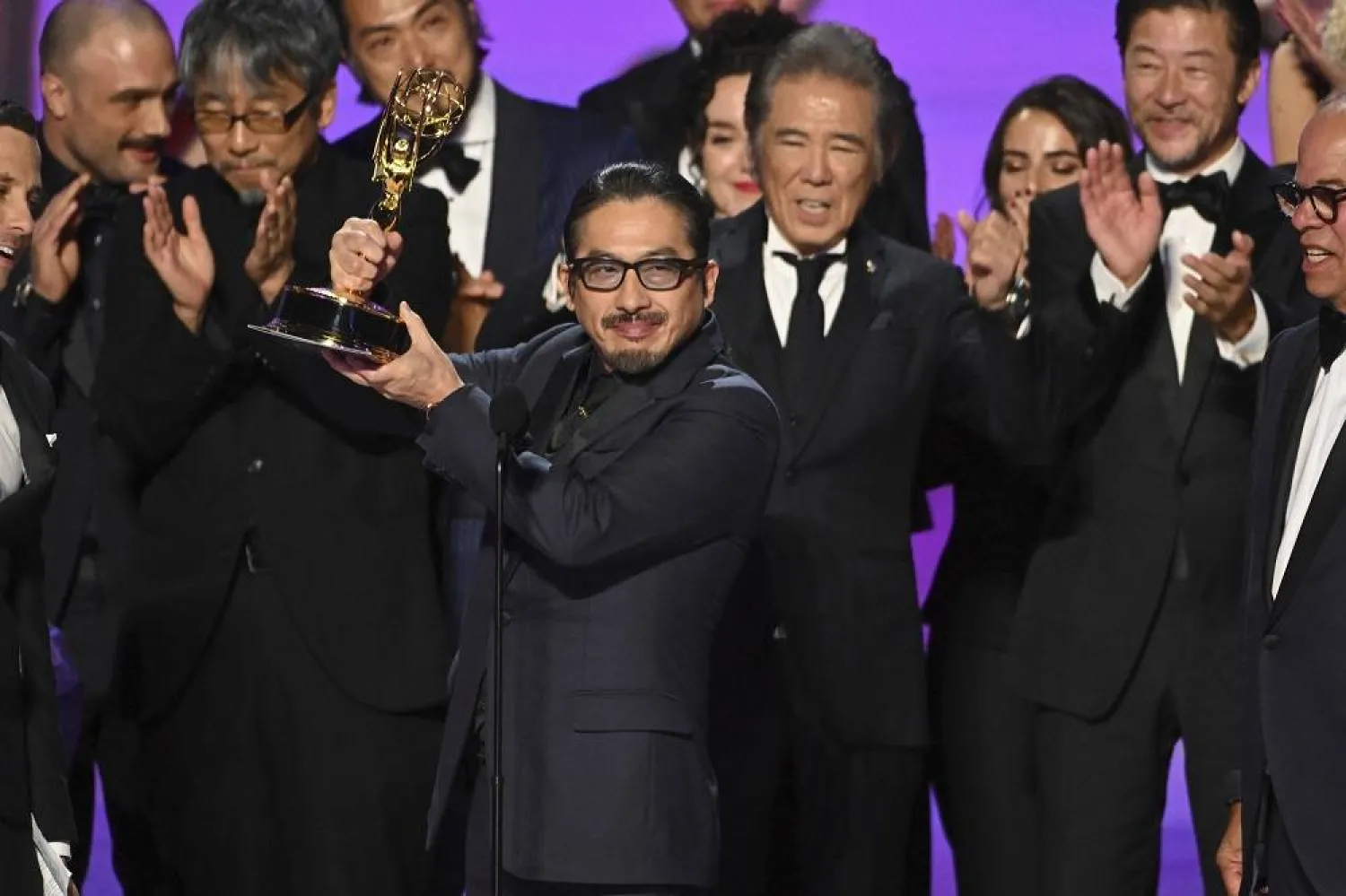 Hiroyuki Sanada, center, and the team from "Shogun" accept the award for outstanding drama series at the 76th Emmy Awards on Sunday, Sept. 15, 2024 at the Peacock Theater in Los Angeles. (Invision for the Television Academy/AP Content Services)