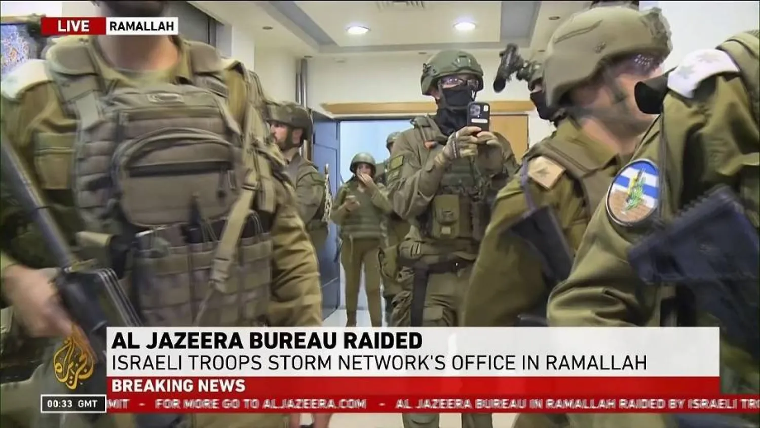 This image made from video provided by Al Jazeera English shows Israeli troops raiding their bureau in Ramallah, West Bank, Sunday, Sept. 22, 2024. (Al Jazeera via AP)

