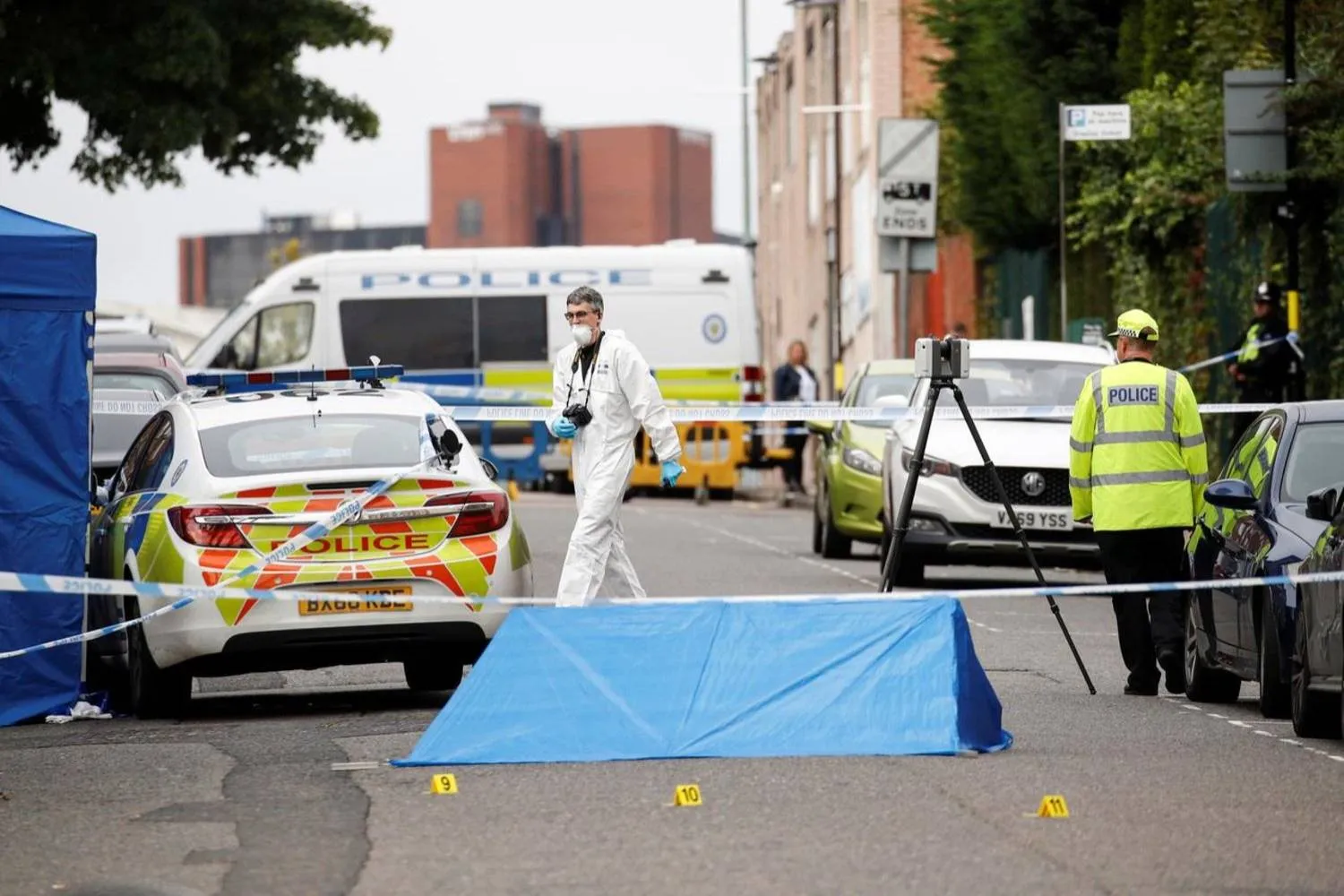 File photo: Police officers and a forensic worker are seen at the scene of reported stabbings in Birmingham, Britain, September 6, 2020. REUTERS/Phil Noble
