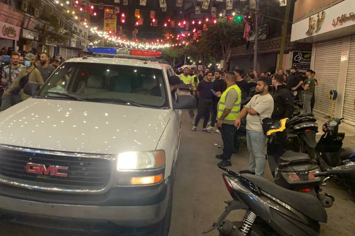 Emergency responders gather at the site of an Israeli strike on Beirut's southern suburbs on September 23, 2024. (AFP)