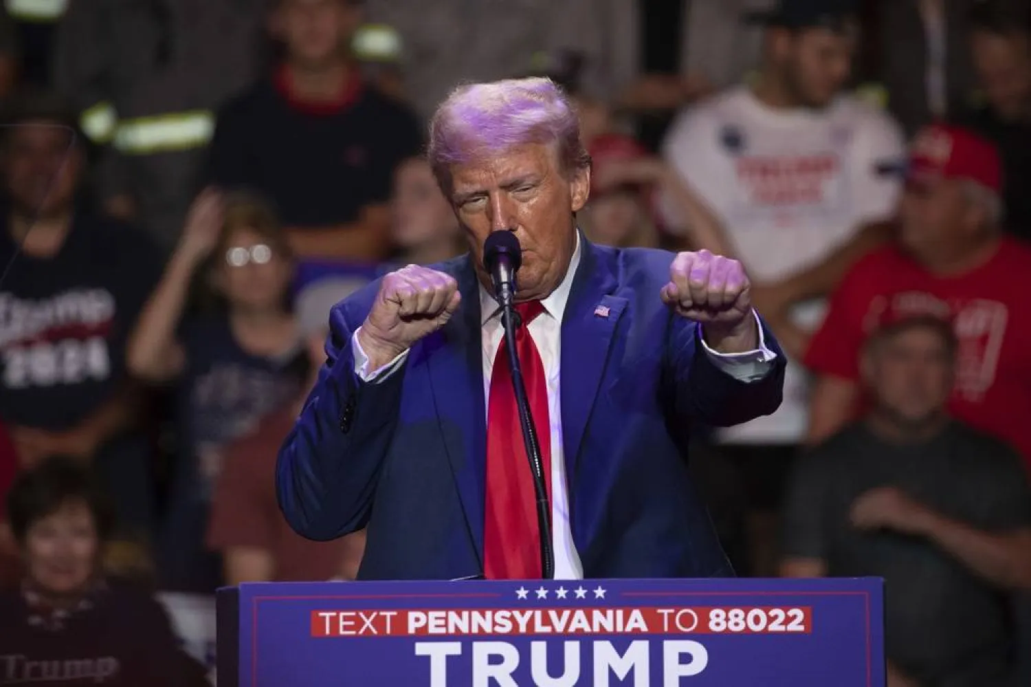  Republican presidential nominee former President Donald Trump makes a boxing gesture as he talks women's Olympic boxing during campaign rally at Ed Fry Arena in Indiana, Pa., Monday, Sept. 23, 2024. (AP)